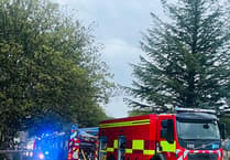 Emergency services tackle fire inside shipping container