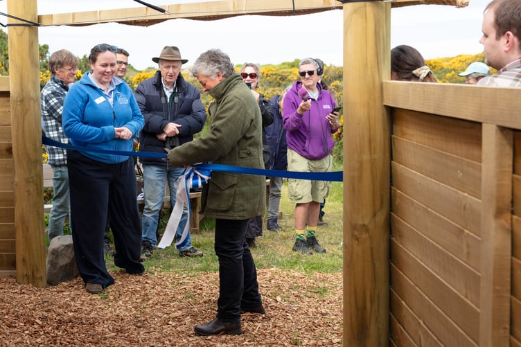Manx BirdLife patron, Lady Philippa Lorimer, cutting the ribbon on the charity's new education the shelter at the Point of Ayre National Reserve