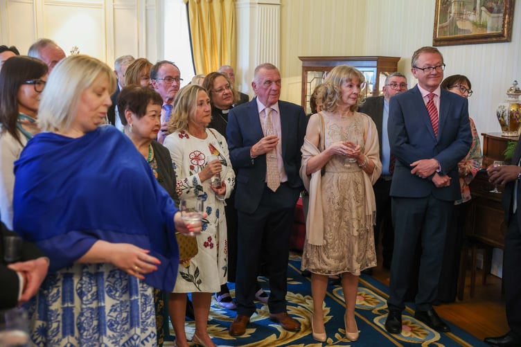 Friends, family and colleagues look on