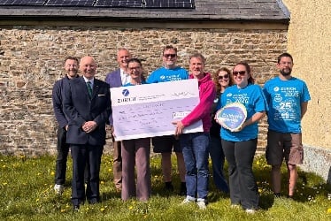 The Lieutenant Governor Sir John Lorimer and Zurich employees at the cheque presentation to The Children’s Centre