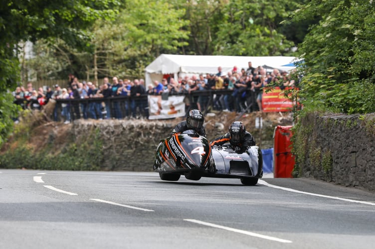 John Watterson MBE (inset) says it would be a huge travesty if sidecars were permanently lost from the TT. Pictured is Dave Molyneux & Daryl Gibson  at Union Mills during 3Wheeling.Media Sidecar Race 1 in 2022. Photo by Callum Staley (CJS Photography).
