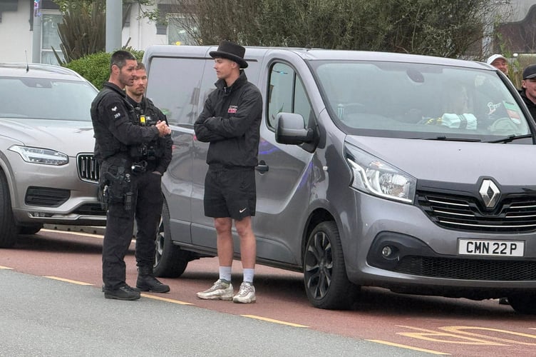Police speaking to North West 200 winner Storm Stacey after his pick-up truck was seized on Harris Promenade last night (Monday). Photo: Baylon McCaughey