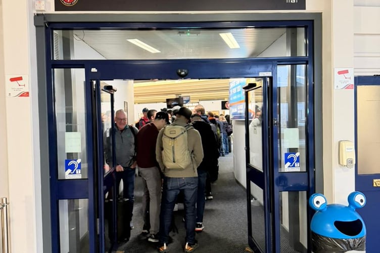 TT visitors at the Sea Terminal after being taken by bus from the airport
