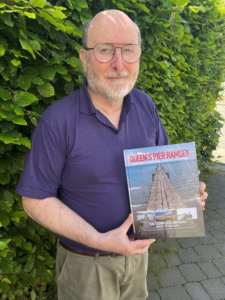 Robert Stimpson with his new book on the history of Queen's Pier