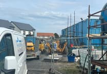 Work on stalled housing estate could soon restart as firm apologises for delay