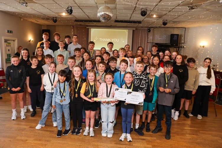 Junior members of Douglas Swimming Club with the King's baton