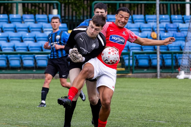 RYCOB goalkeeper Ryan Quigley and Castletown's Luca Simmons compete for the ball during Saturday's contest (Photo: Gary Weightman)