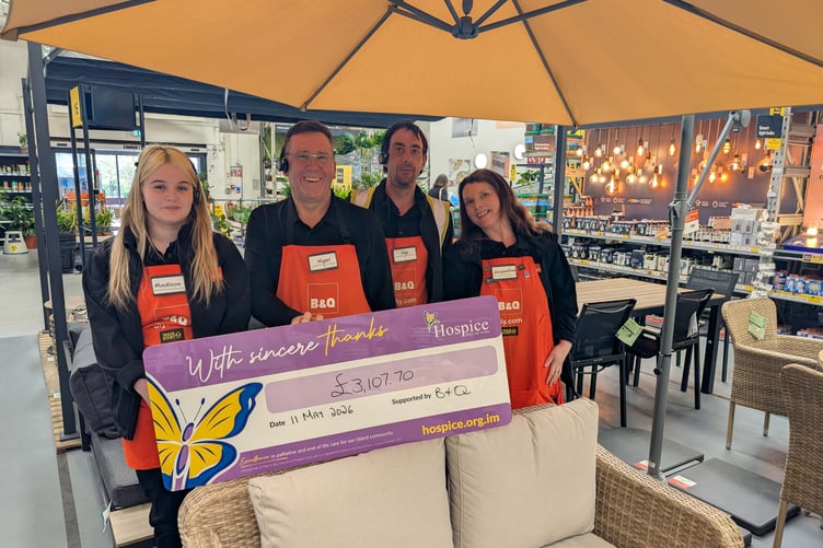 The B&Q team with the cheque for Hospice Isle of Man