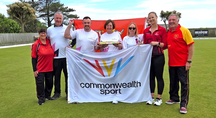 Members of Lawn Bowls Club Isle of Man - including some of those who will represent the island at next month's Commonwealth Games - with the King's Baton. They are pictured alongside Team Isle of Man chef de mission Erica Bellhouse