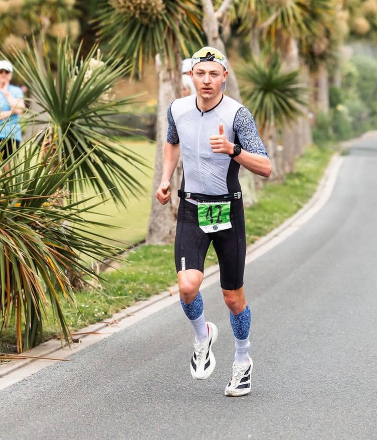 James Read gives a thumbs up on his way to winning last weekend's Patrick Crookall Middle Distance Triathlon in Ramsey (Photo: DK Photography)