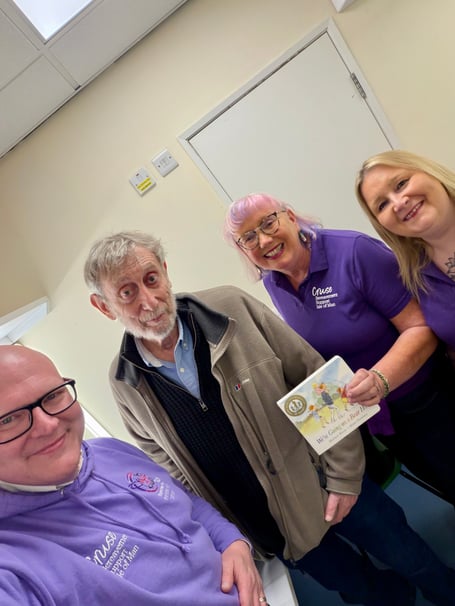 (Left to right) Cruse's John Whitehouse, Mary Doyle and Claire Brew with Michael Rosen