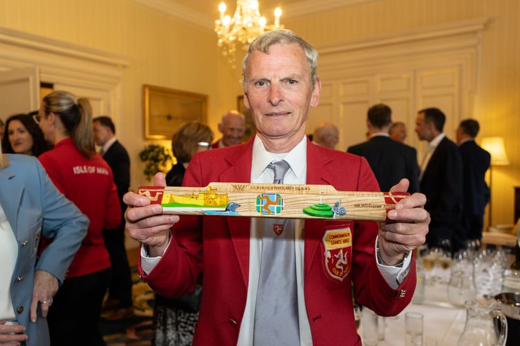 Robbie Lambie, who competed at the 1982 Commonwealth Games, with the baton