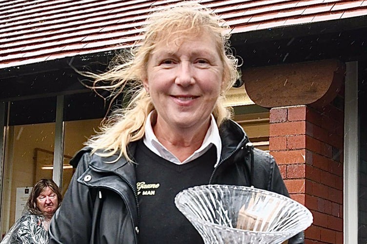 Sue Gawne receives the Visitiom.com trophy for being the furthest local woman in the main festival event (Photo: Arnie Withers)