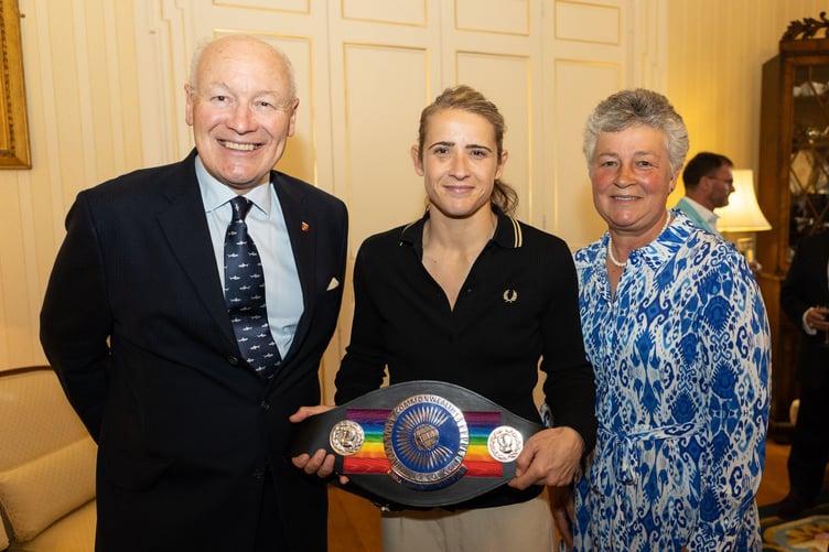 The Lieutenant Governor Sir John Lorimer with island boxer Jade Burden and Lady Lorimer