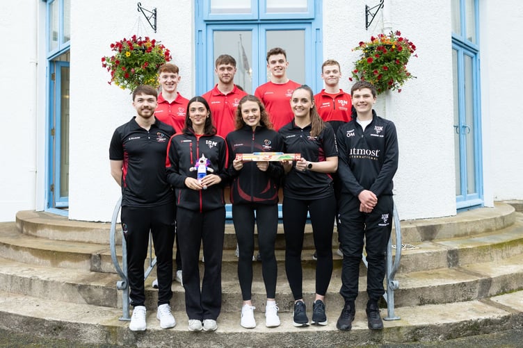 Isle of Man swimmers with the baton outside Government House