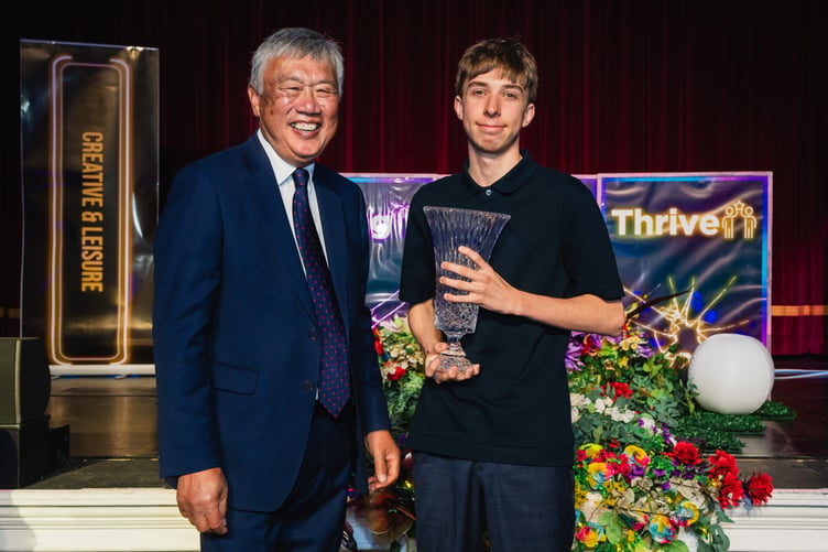 Owen Pilley award being presented by UCM Chair of Governors Leslie Wong