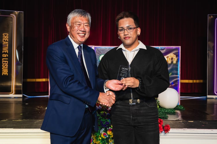Mark Andrei Gallero award being presented by UCM Chair of Governors Leslie Wong
