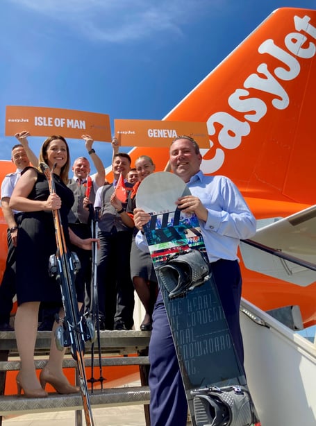 Isle of Man Airport's commercial director Hannah Lo Bao and head of airfield operations Luke Mosley with easyJet crew celebrating the new route to Geneva