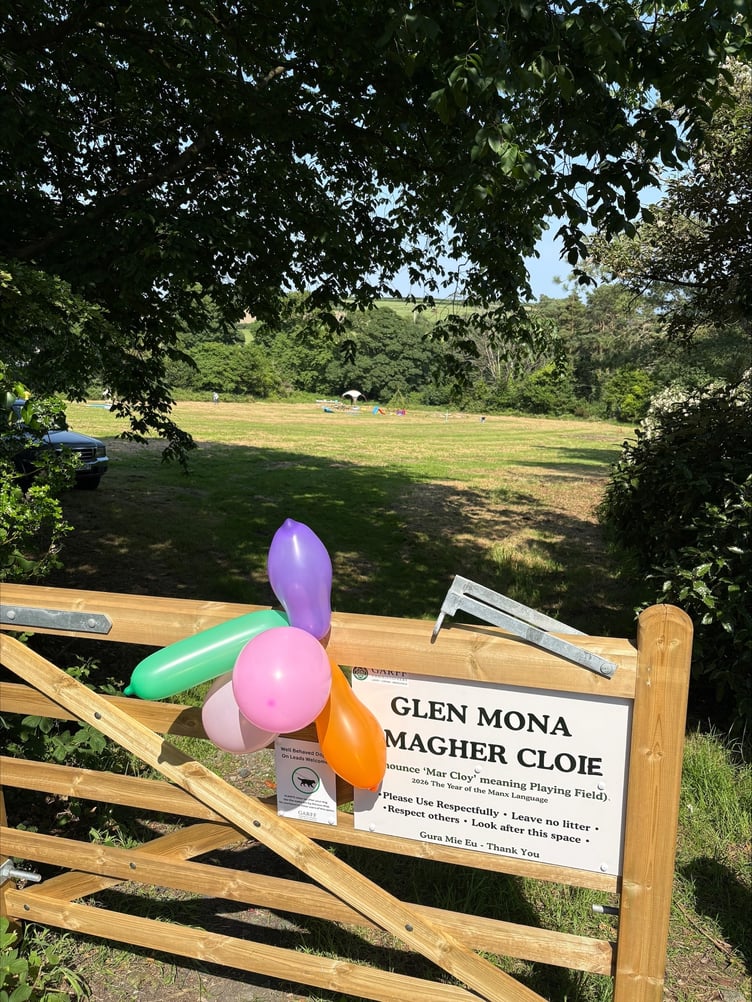 Balloons are placed on the gateway into the new playing field to mark its opening