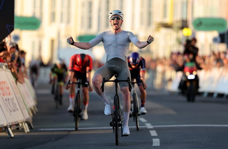 Matthew Bostock celebrates as he crosses the finish line in Aberystwyth to win the British National Circuit Championship race on Friday evening (Photo: Alex Whitehead/SWpix.com)