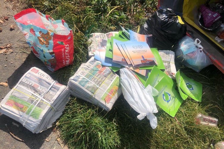 Bundles of the Courier dumped a a Beach Buddies bin at Blue Point near the Ayres