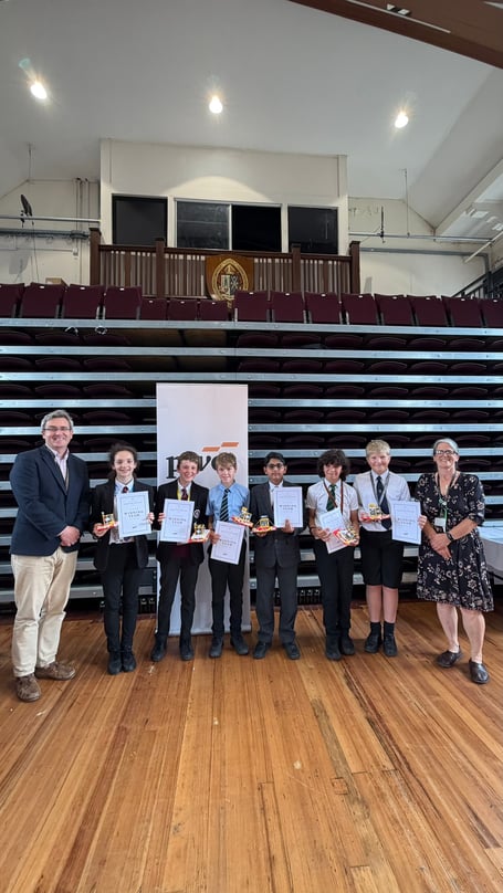 The winning team: Sophie (SNHS), Rishawn (KWC), Jasper (QEII), Rollo (CRHS), Oshyn (RGS) and Douglas (BHS) pictured alongside KWC Headteacher Damien Henderson and Head of Mathematics Anouk de Vos