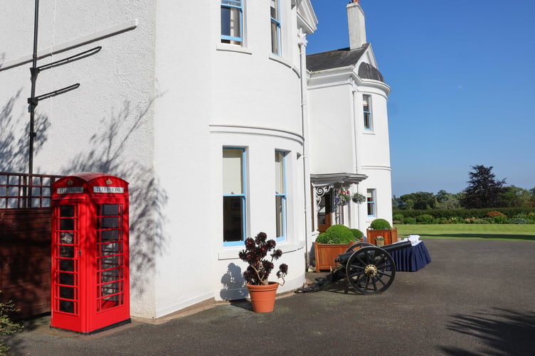 The telephone box is located outside the front of Government House
