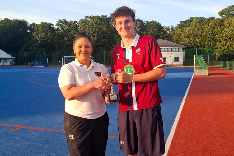 Big Booty Bacchas captain Jack Grimley receives the Pro League trophy from MHA chair Kim Carney