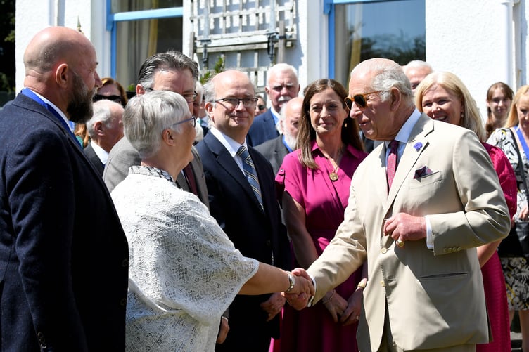 King Charles III greeting members of the public