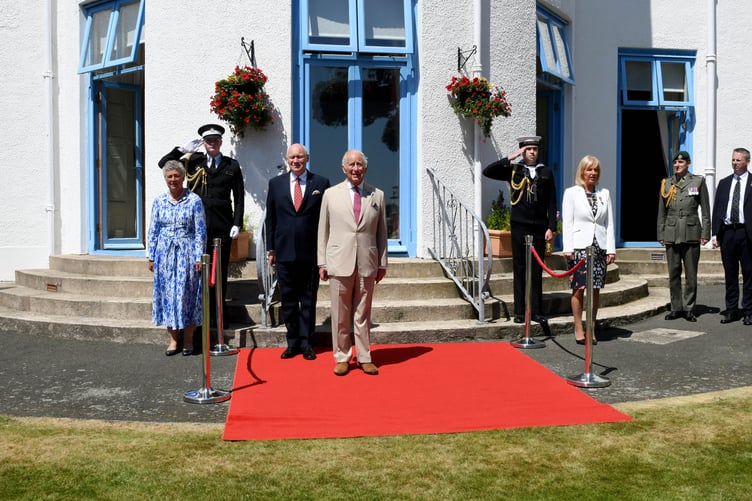 King Charles III was greeted by officials at the Government House