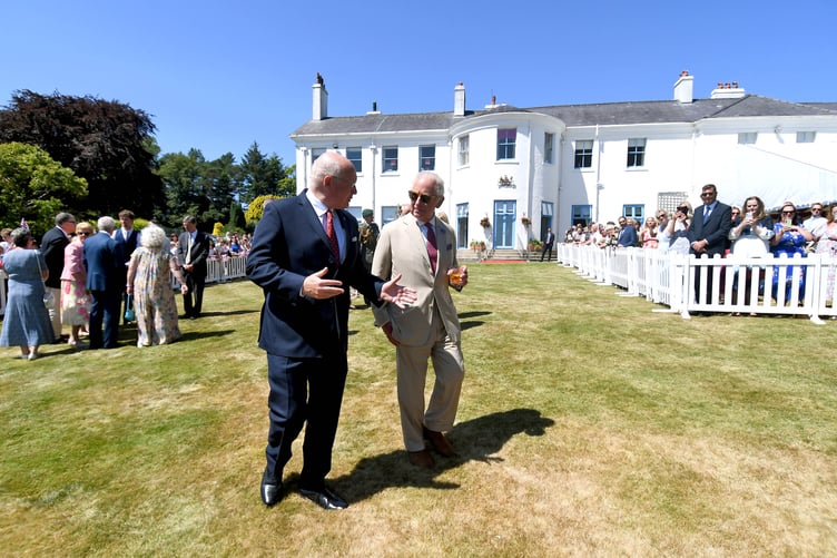 Lieutenant Governor Sir John Lorimer and King Charles III enjoying a chat in the sunshine
