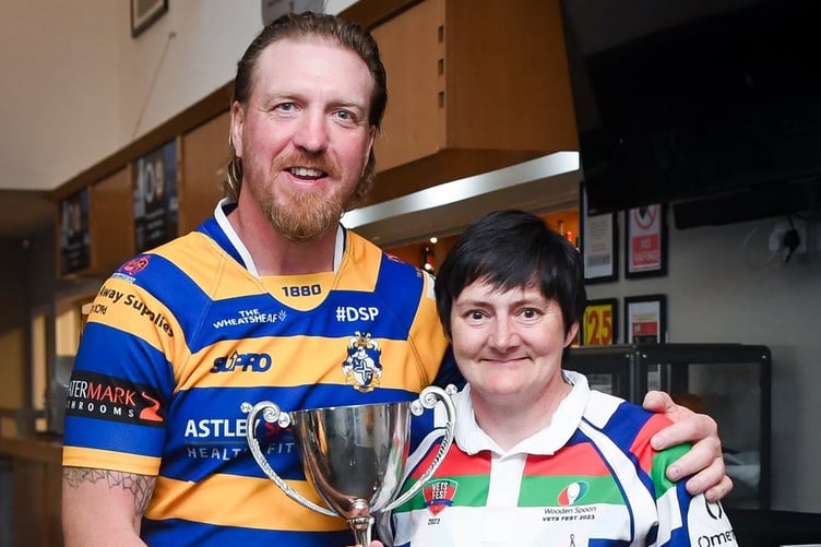 Sammie MacDonald is presented with the Women's Captain’s Cup & Player of the Year awards from Andy Powell during the evening at Ballafletcher