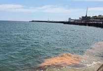 Strange orange water appearing off the Isle of Man coast explained
