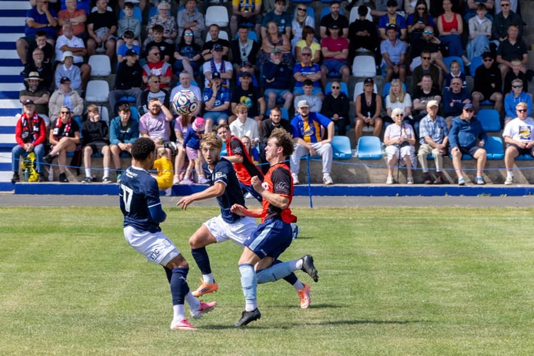 In front of a large crowd at Ballacloan Stadium, Dean Pinnington competes for the ball against two Shrewsbury players during Sunday's third place play-off (Photo: Hannah McHugh)