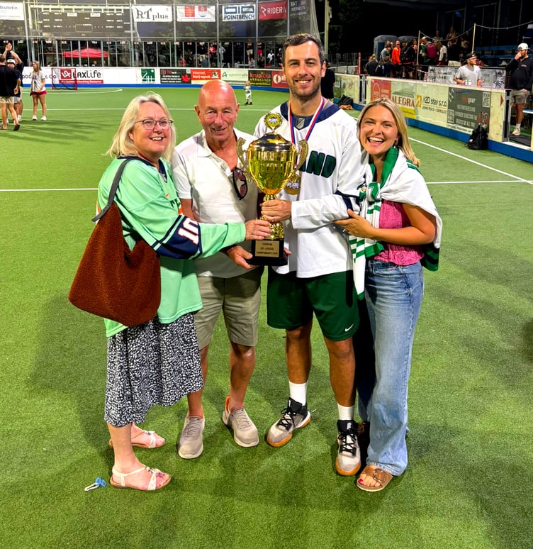 Seán Keane pictured holding the European championship trophy alongside (left to right) his mum Karen, dad Jimmy and fiancé Alice Beadle
