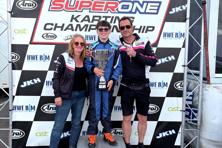 Charlie Gregg pictured alongside team owners Paul and Claire Weaver on the podium