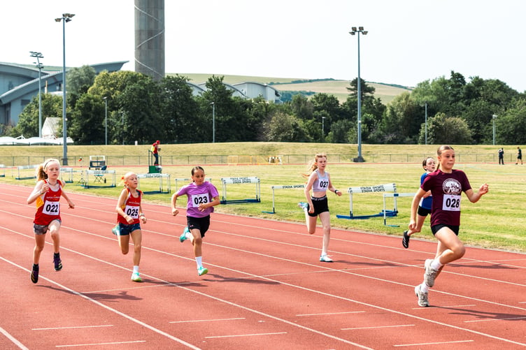 Freya Megson powers ahead of her rivals to win the under-12 girls 75m race at the NSC (Photo: DK Photography)