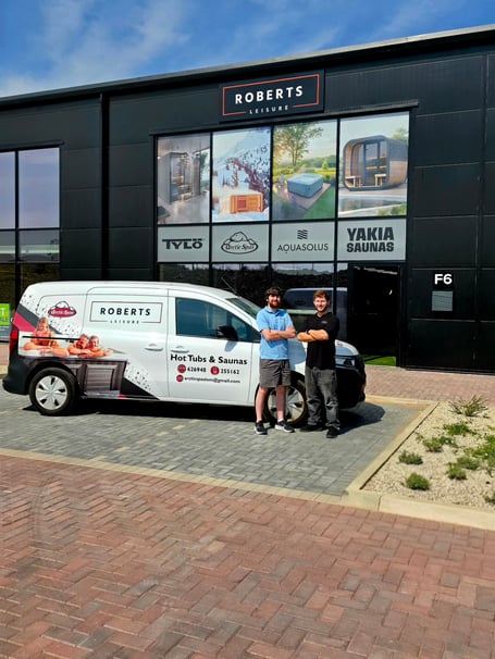 Luke alongside his close friend outside of the new Roberts Leisure showroom