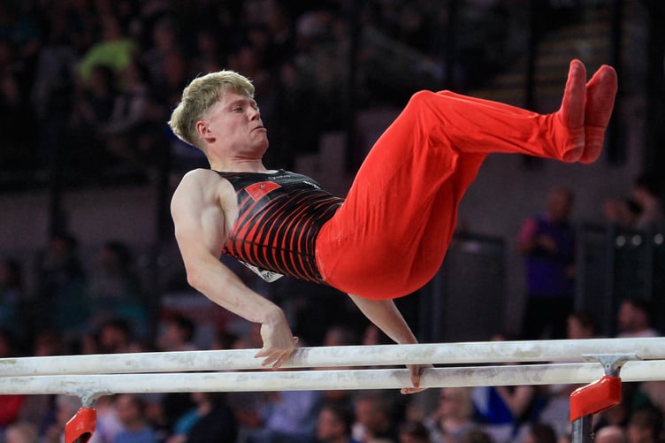 Harry Eyres in action during his parallel bars routine at Glasgow International Arena (Photo: Dave Norton)