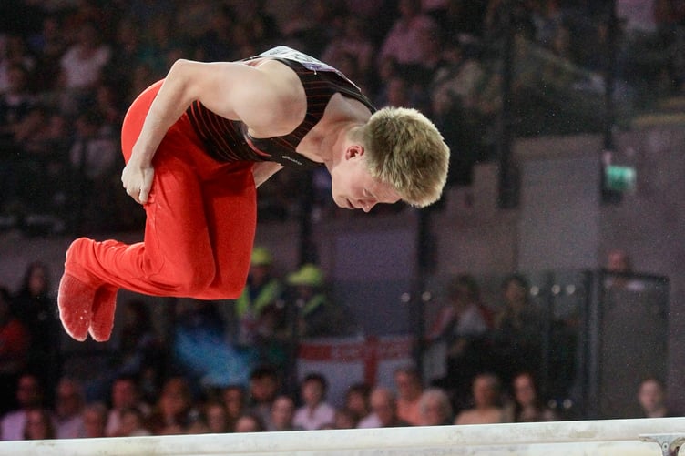Harry Eyres in action during his parallel bars routine at Glasgow International Arena (Photo: Dave Norton)