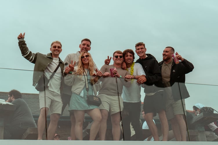A group of friends were all smiles as they looked down from the balcony (Kyle McKee Photography)