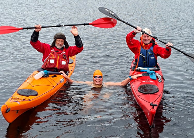 Isle of Man swimmer Carole Laporte flanked by Steve Watt (left) and John Speakman at Loch Awe in Scotland