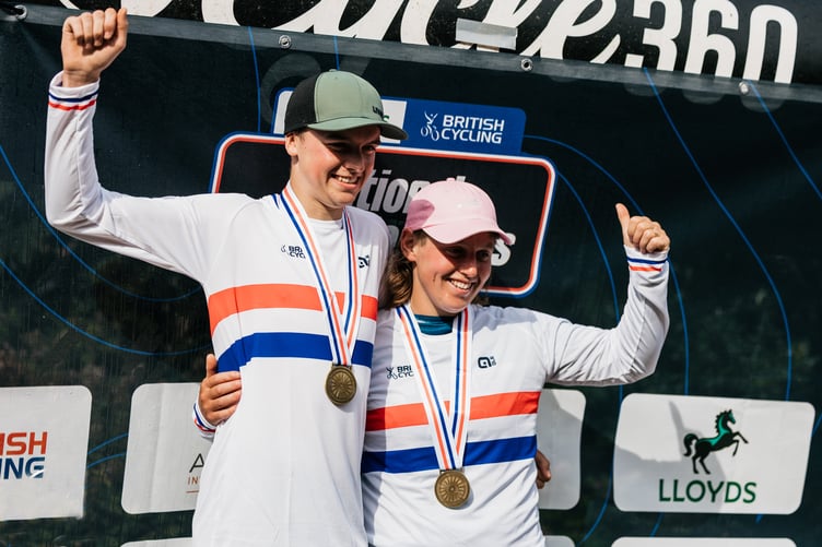 Henry Timewell and Bex Barron celebrate in their national jerseys on the podium after their triumphs in the Manx MTB Enduro-hosted event (Photo: Ricciardi Media)