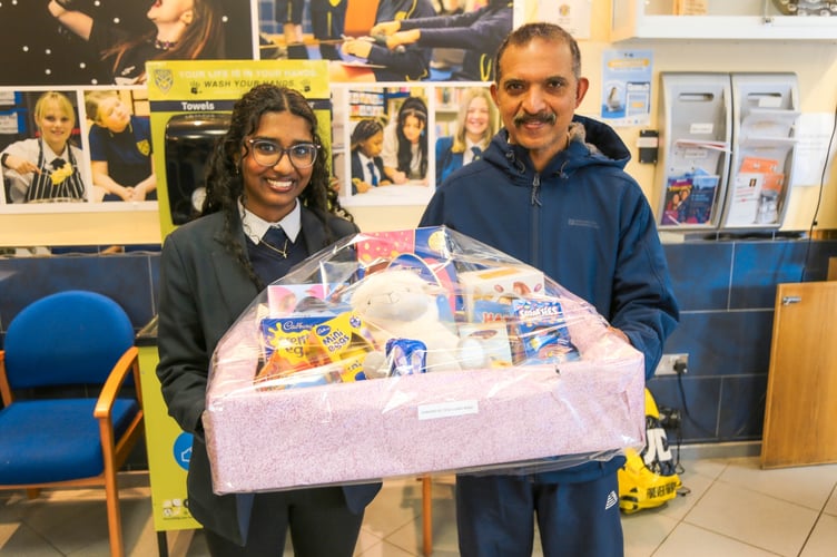 Happy raffle winners collecting their hamper!