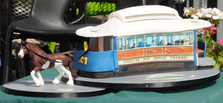 A picture was taken of the first trip by tram 27 on Friday morning and later reproduced onto the cake when it was decorated