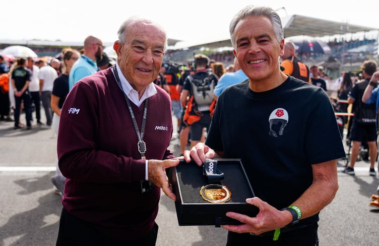 Peter Duke (right) receives the Hall of Fame medal from MotoGP chief executive officer Carmelo Ezpeleta on behalf of his father and six-times world champion, Geoff Duke OBE (Photo: MotoGP.com)