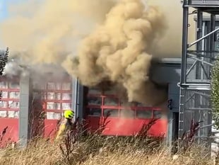 Explosions heard as 'major' fire rips through site
