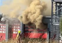 Explosions heard as 'major' fire rips through building - live updates