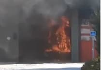 Main road to airport shut as blaze rips through fire and ambulance station