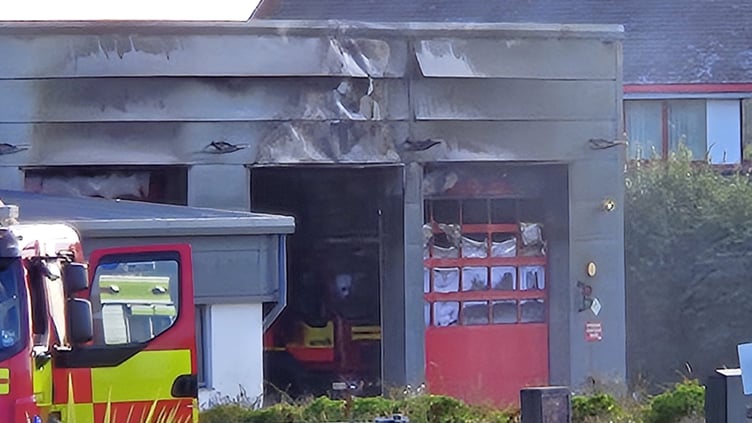 Fire damaged Castletown and Malew fire station with a fire appliance inside